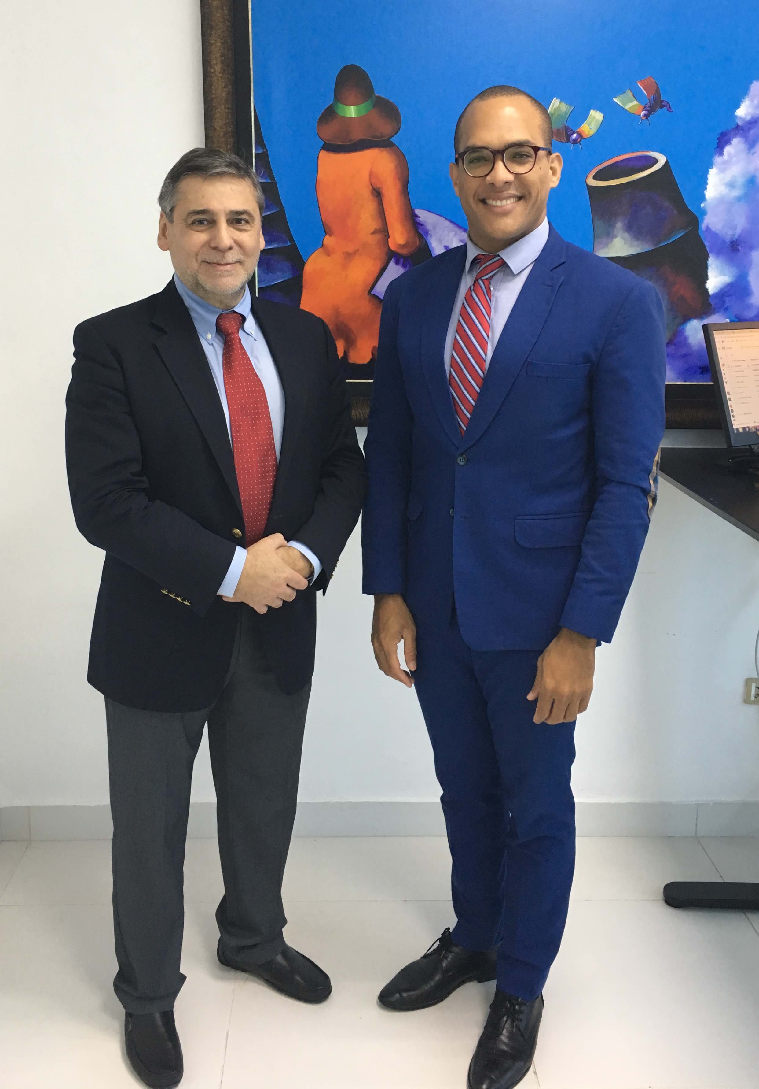 group photo of the two men in business suits